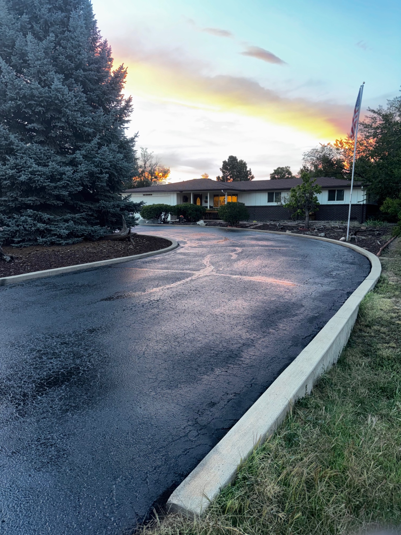 Sealcoated residential driveway at sunset